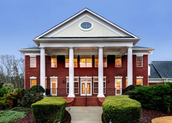 Large red and white house with pillars